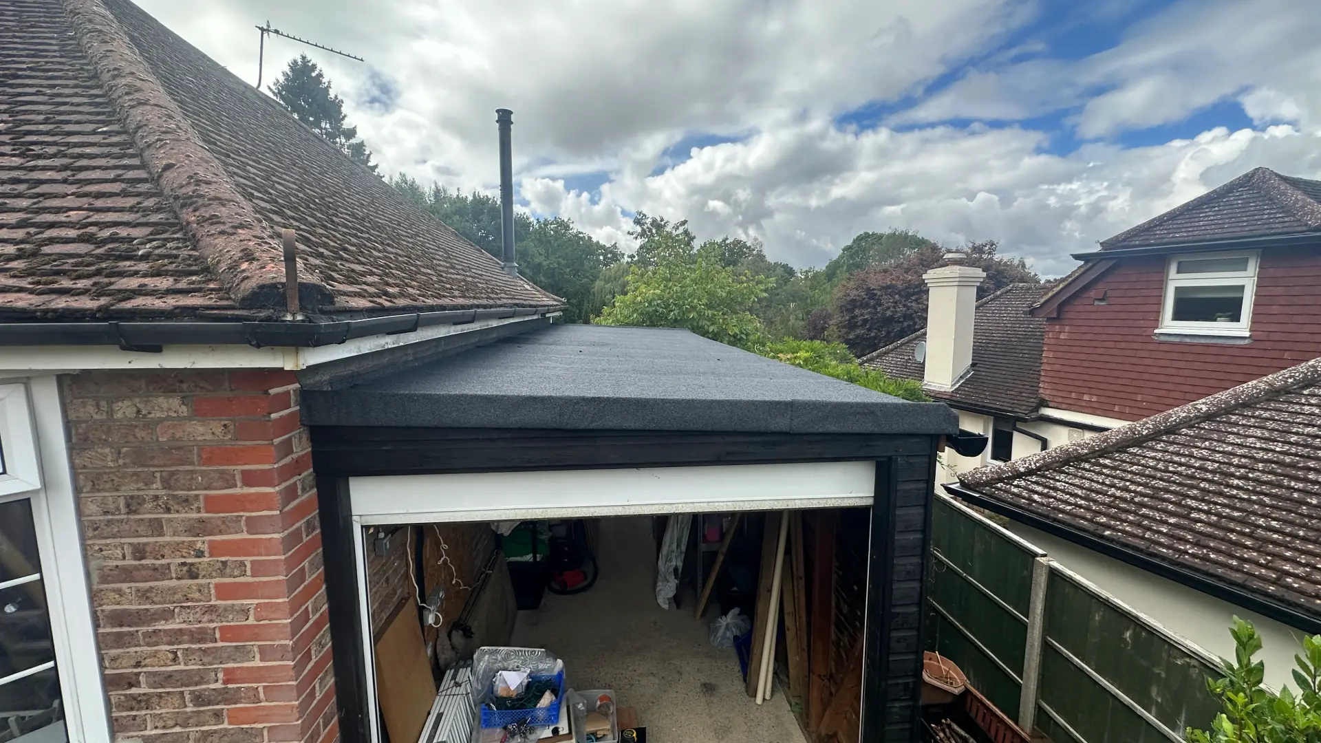 After — completed garage roof repair in Henfield