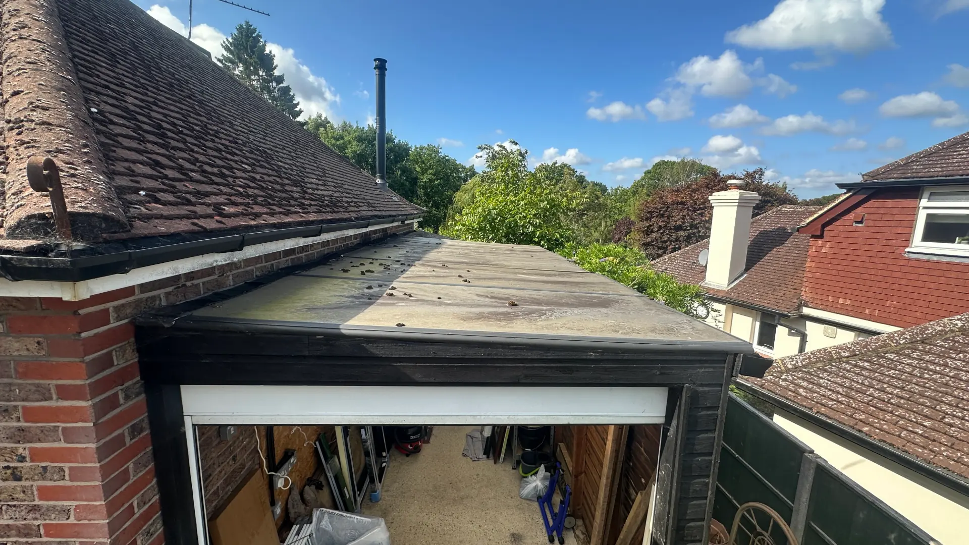 Before — damaged Henfield garage roof requiring remedial repair
