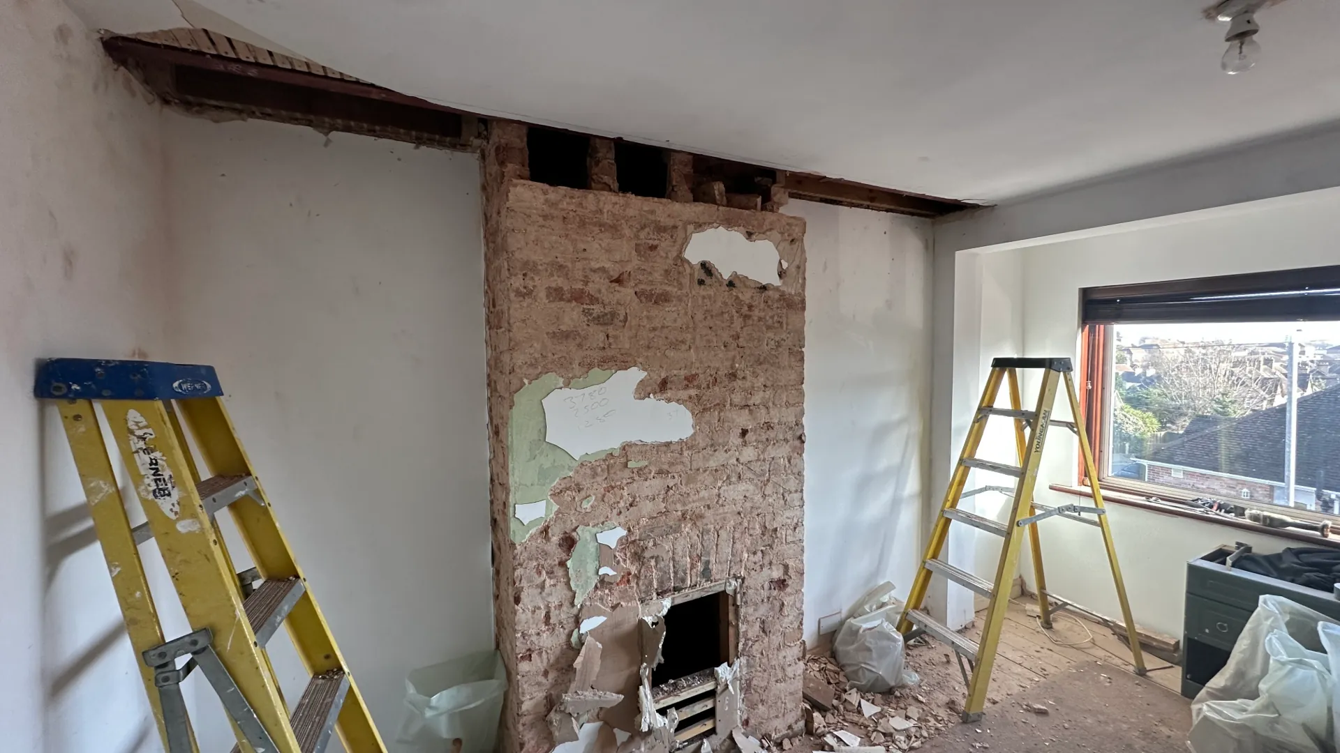 Before — Mile Oak property with chimney prior to removal